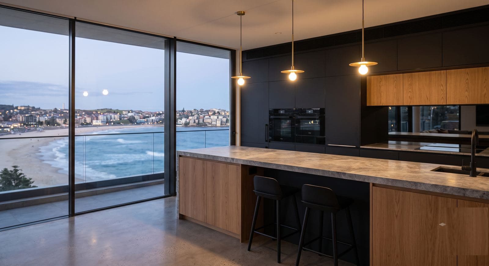 A modern kitchen with built-in wall ovens and an induction cooktop