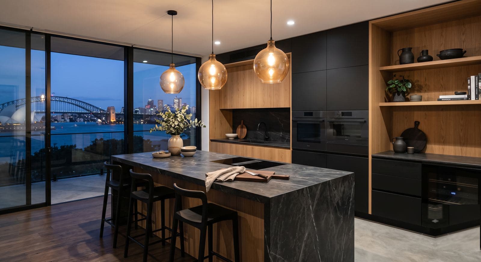A modern kitchen with integrated appliances behind cabinet doors
